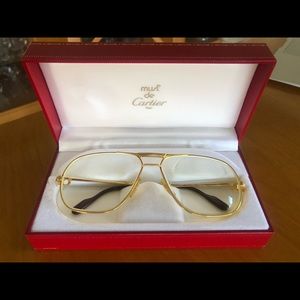 Cartier gold eye glasses.